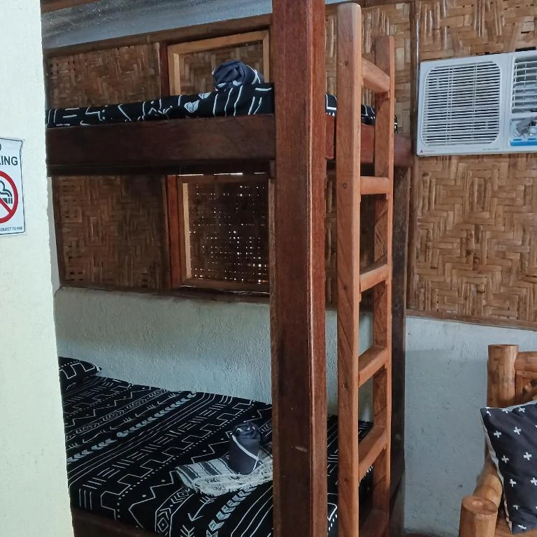 Wooden bunk beds and air-conditioning unit — Family Room with Garden View