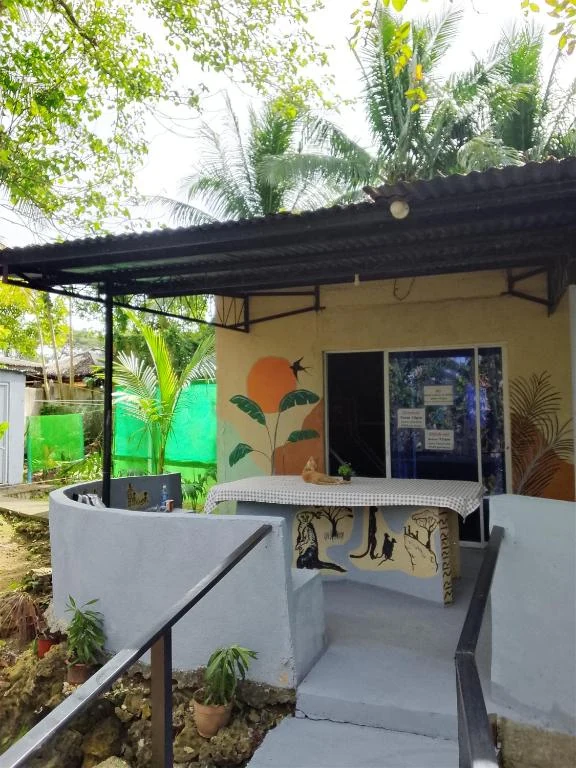 Steps and entrance beneath a shaded roof — Family Room