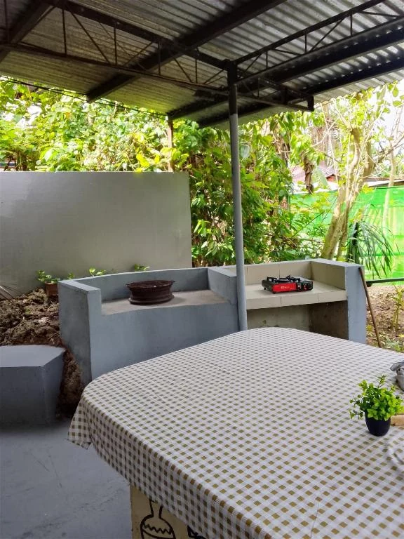 Covered outdoor table and seating — Family Room
