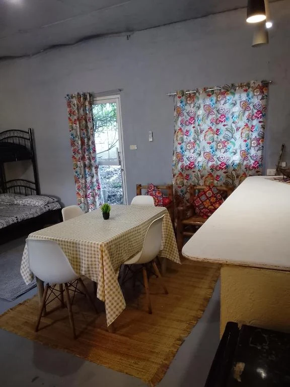 Beds, dining table and seating area — Family Room